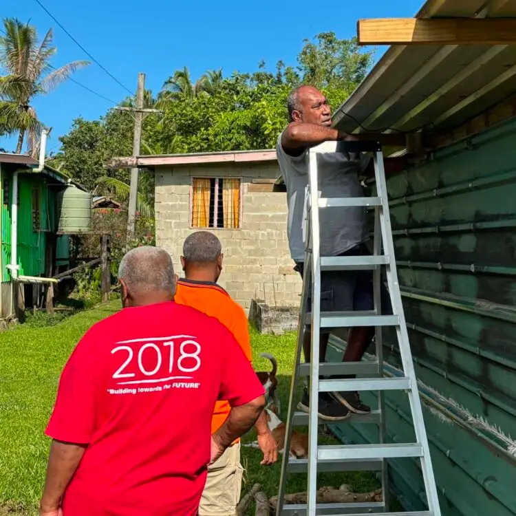 Adjusting the roof to align properly while riveted.