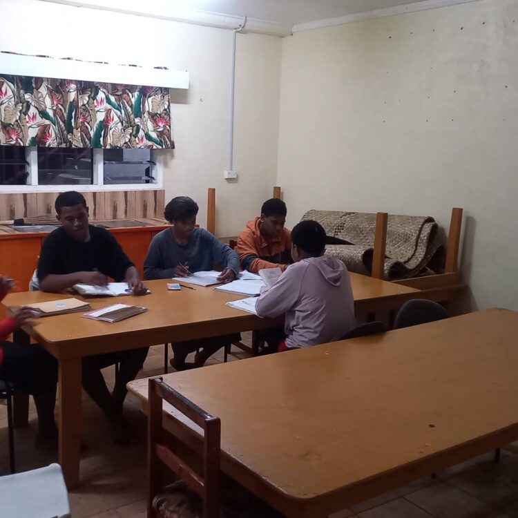 Secondary School Kids busy at work during their early evening session.